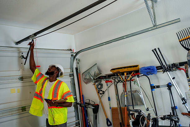 Professional Garage Door Panel Replacement technician working in Marquette, MI